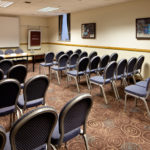 Tables and chairs in the broker room prepared for a meeting at mercure glasgow city hotel
