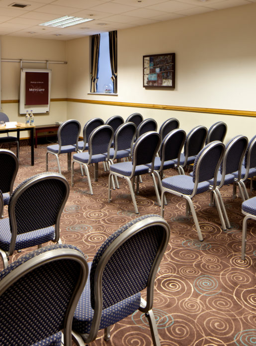 Tables and chairs in the broker room prepared for a meeting at mercure glasgow city hotel