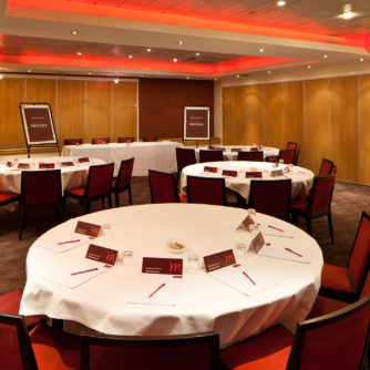 Tables and chairs in the buchanan suite prepared for a meeting at mercure glasgow city hotel