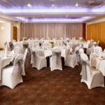 The buchanan suite set for a wedding breakfast with purple lighting at mercure glasgow city hotel