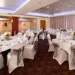 The buchanan suite set for a wedding breakfast with purple lighting at mercure glasgow city hotel