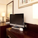 Desk, chair and TV stand in a classic room at mercure glasgow city hotel