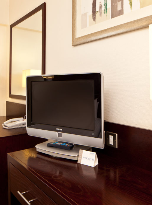 Desk, chair and TV stand in a classic room at mercure glasgow city hotel