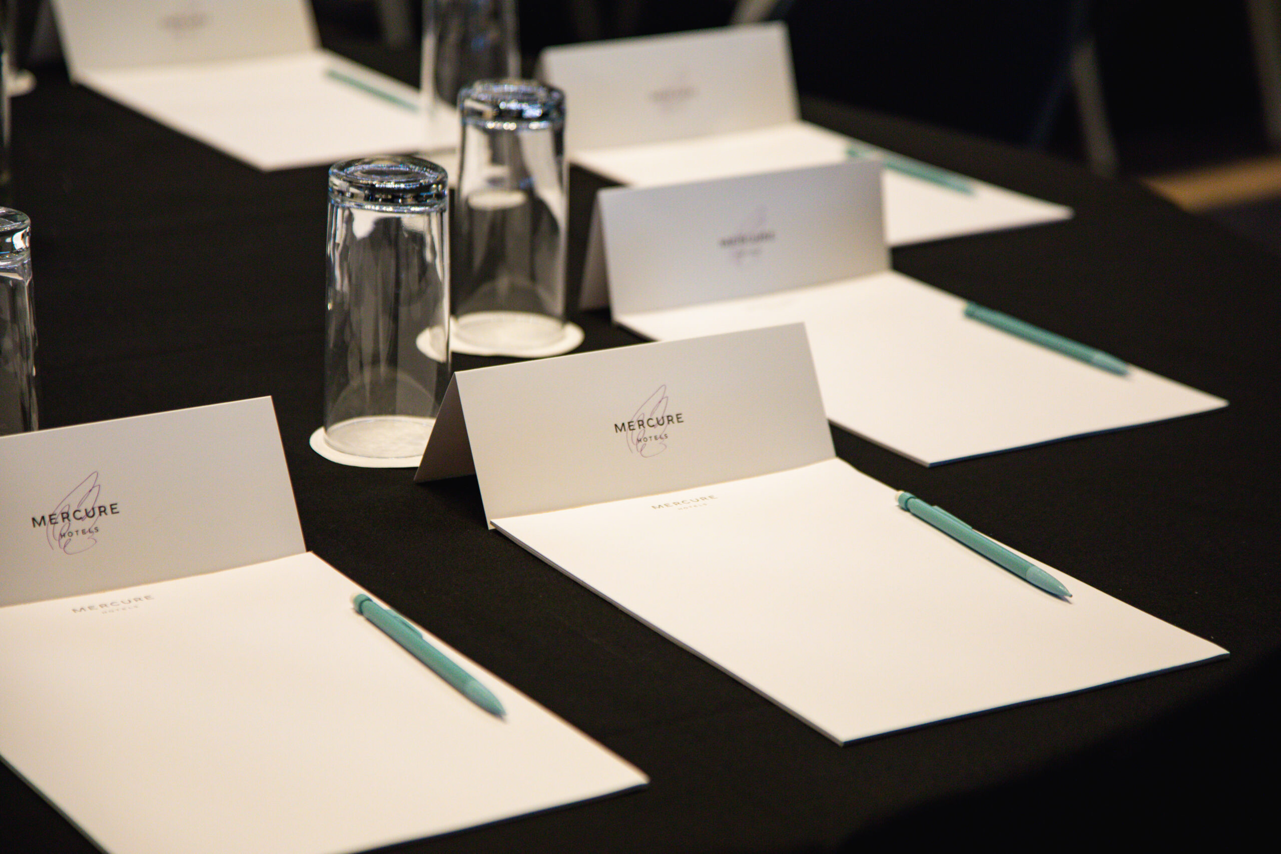 Mercure-branded notepaper set up ready for a meeting at a Mercure Hotel