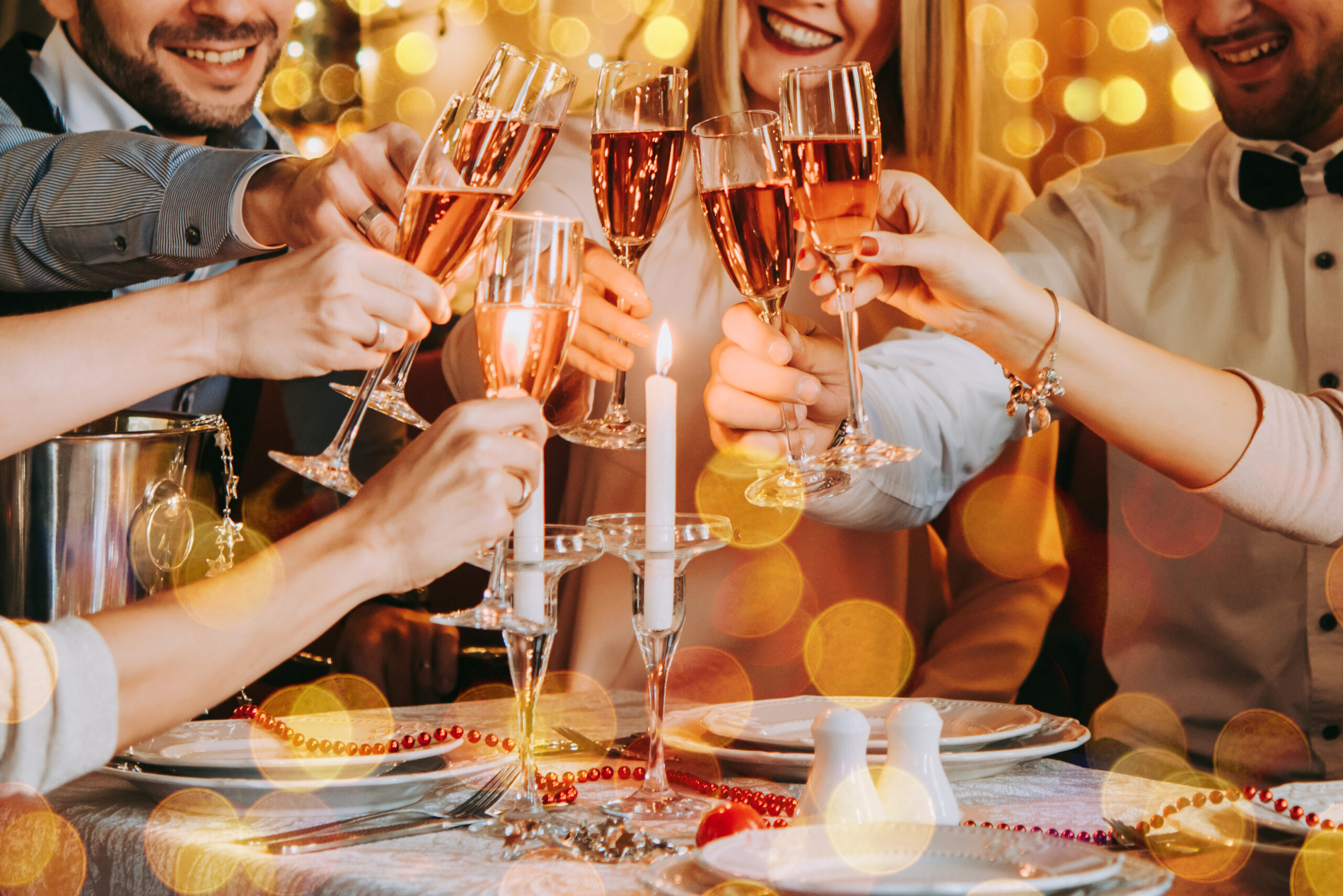 Friends,Celebrating,Christmas,Or,New,Year,Eve.,Party,Table,With Work colleges partying