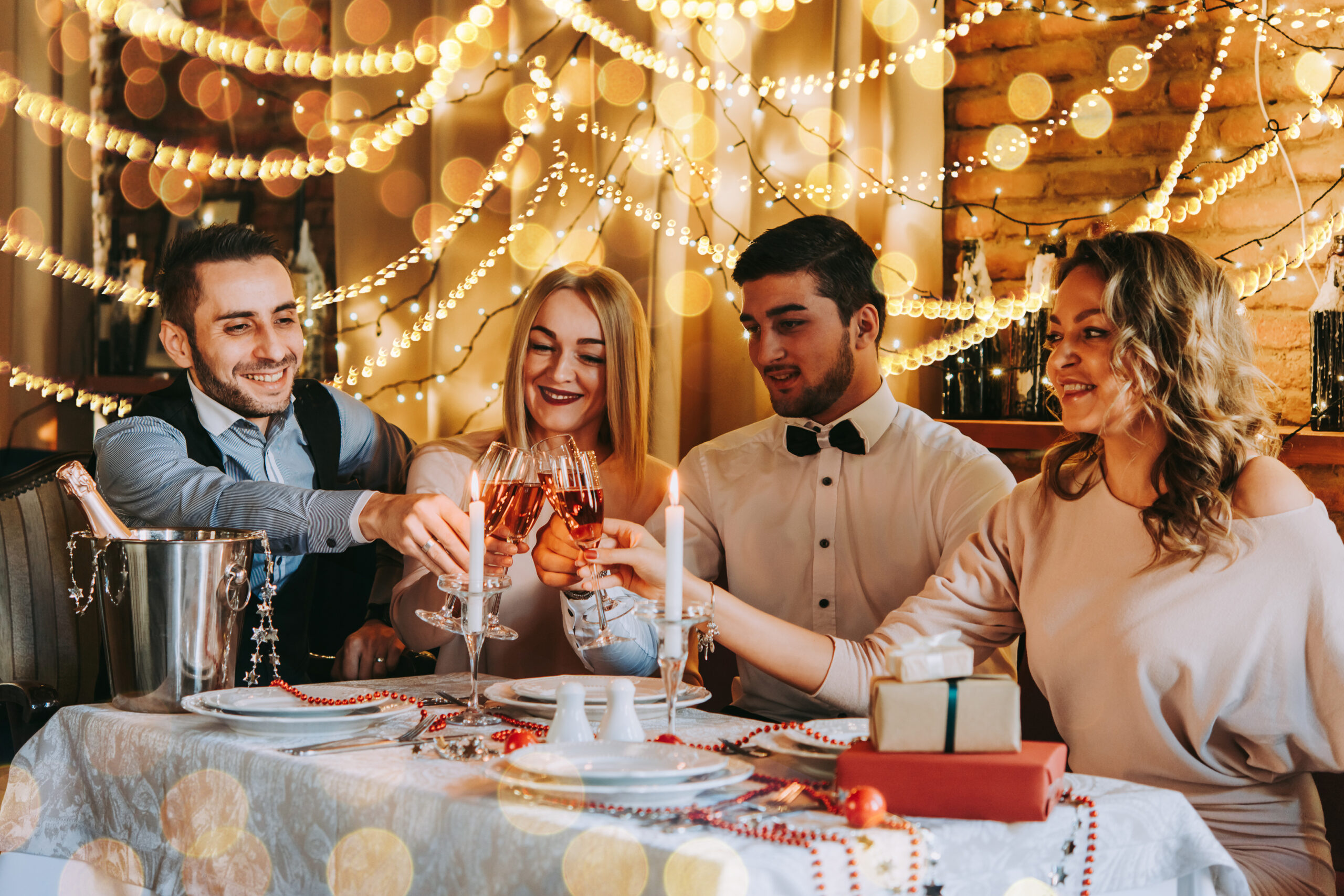 Friends,Celebrating,Christmas,Or,New,Year,Eve.,Party,Table,With Work colleges partying